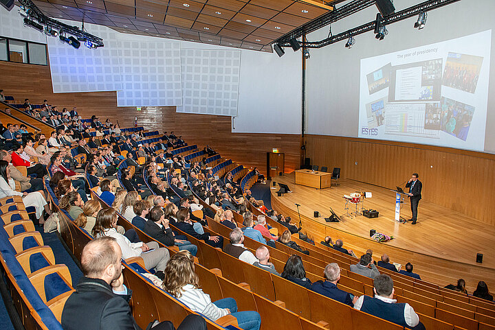 Participants listen to a speech in the lecture theatre